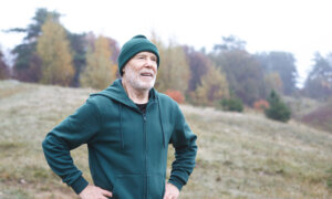 Canadian man at 71 thinking about his RRIF withdrawal plan on a walk.