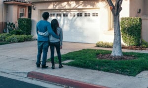 Canadian couple outside of home, wondering if they should transfer it to their corporation.