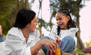A young mom and her daughter in a park