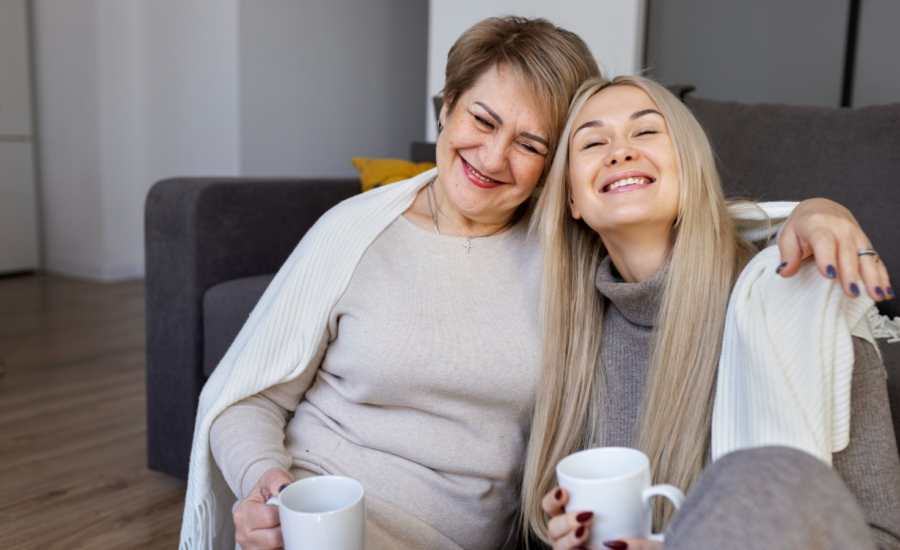 A middle-aged woman on a couch with her daughter