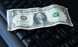 Close-up of an American dollar bill on a computer keyboard
